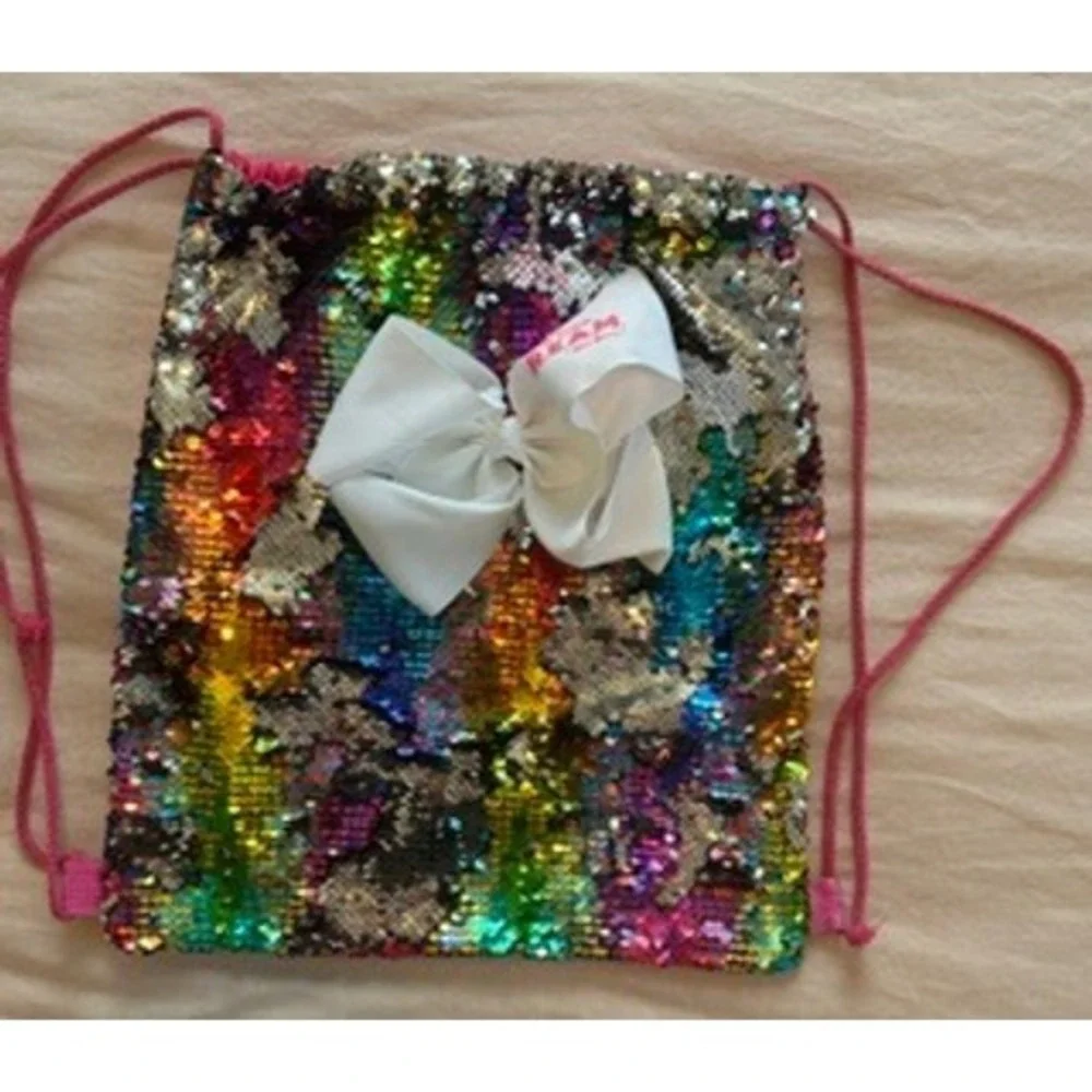 JoJo Siwa DREAM The Tour Rainbow Flip Sequin Drawstring Bag with White Bow Pink